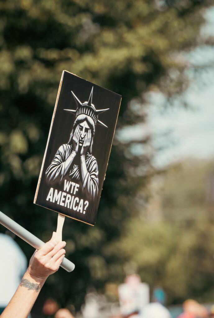 protest sign with statue of liberty imagery
